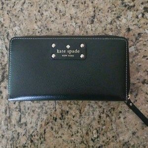 Zippered Kate Spade black wallet.